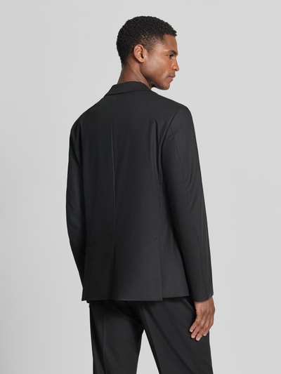 Männermodel trägt Sakko mit Reverskragen und Brustleistentasche Modell 'CATORY' von Drykorn in Schwarz, Material-Mix mit Viskose-Anteil, Regular-Fit, Ganzkörperansicht Rückansicht. Rückenlänge 72 cm, Schulterbreite 50 cm, Ärmellänge 66 cm bei Größe 50.