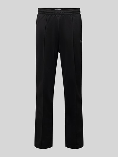 Produktfoto, spodnie typu track pants z Längsnähten Modell 'Motus' von Pegador, mieszanka bawełny, krój relaxed fit, elastyczny pas, długość wewnętrzna nogawki 75 cm w rozmiarze M, kolor czarny, prosta nogawka, gładka tekstura