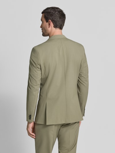 Männermodel trägt olivgrünes slim fit Slim Fit Sakko mit Viskose-Anteil Modell 'LIAM' von Selected Homme, Heren. Ganzkörperansicht Rückansicht.