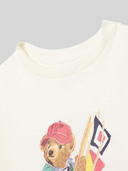 Produktfoto, Regular Fit T-Shirt aus reiner Baumwolle von Polo Ralph Lauren Kids in Unifarben mit Motiv-Print, Label-Schriftzug, Rundhals, Kurzarm, Feinrippstruktur.