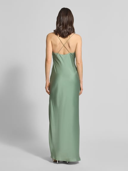 Kobieta modelka ma na sobie Regular Fit Abendkleid mit Rückenausschnitt von Unique, satyna, kolor zielony, długość 128 cm, szerokość w rozmiarze 36: 40 cm, widok całej sylwetki z tyłu.