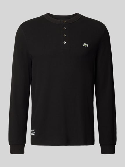 Produktfoto, Regular Fit Langarmshirt aus reiner Baumwolle von Lacoste in Schwarz mit Knopfleiste und Logo, Herren Langarmshirt von Lacoste