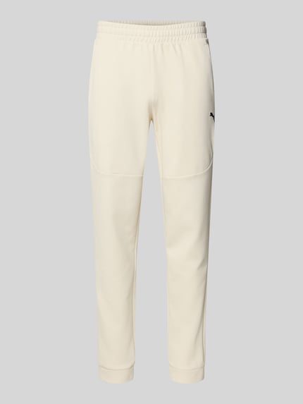 Produktfoto, Regular Fit Sweathose mit Logo-Print Modell 'Pumatech' von PUMA PERFORMANCE, Herren, Baumwoll-Mix, cremefarben, elastischer Bund, Eingrifftaschen, elastische Beinabschlüsse, Innenbeinlänge 78 cm.