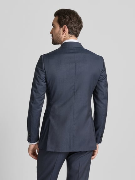 Männermodel draagt 2-Knopen-sakko met reverskraag model 'JOACHIM' van Tiger Of Sweden, regular fit, effen donkerblauw, rugaanzicht.