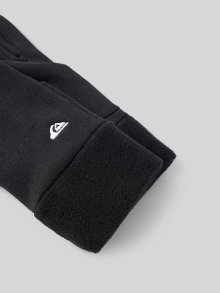 Produktfoto, czarne rękawice dziecięce Handschuhe mit Label-Stitching Modell 'HOTTAWA JR' od Quiksilver z polaru, detal z logo, gładka faktura