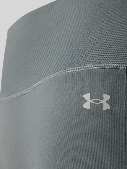 Produktfoto, Slim Fit Leggins mit Logo-Print Modell 'Vanish' von Under Armour, Elastischer-Material-Mix in Grau mit breitem Bund, glatte Textur