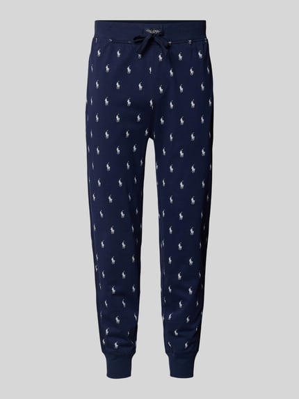 Produktfoto, dunkelblaue Sweathose mit Allover-Logo-Print von Polo Ralph Lauren, lockere Passform, Baumwolle, elastischer Bund