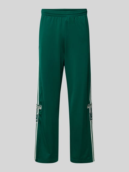 Produktfoto, spodnie dresowe Sweatpants mit elastischem Bund von adidas Originals, luźny krój, elastyczny pas, wpuszczane kieszenie, wyhaftowane logo, długość wewnętrzna nogawki w rozmiarze M: 74 cm, kolor zielony, gładka struktura
