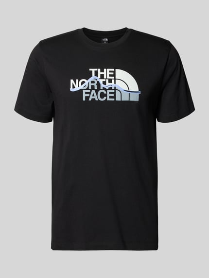 Productfoto, Regular Fit T-shirt van pure katoen model 'MOUNTAIN LINE' van The North Face in zwart met labelprint, ronde hals, ruglengte maat M 70 cm