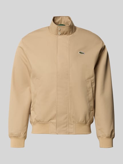 Produktfoto, sandfarbener Blouson mit Logo-Patch Modell 'HARRINGTON BLOUSON' von LACOSTE, Stehkragen, Reißverschluss, gerippte Abschlüsse, unifarben, seitliche Eingrifftaschen