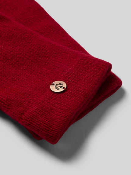 Produktfoto, Handschuhe aus reinem Kaschmir von FRAAS in kräftigem Rot mit gerippten Abschlüssen und Label-Detail, weiche Strickstruktur