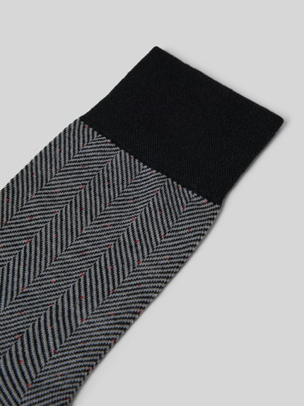 Produktfoto, Socken mit Label-Print von Falke, Schurwoll-Mix in Grau mit schwarzen geripptem Abschluss und feinem Muster, körpernaher Schnitt