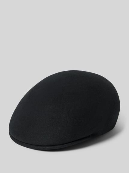 Produktfoto, Schiebermütze aus reiner Wolle von MUELLER HUETE in Schwarz, unifarbenes Design, verstärkter Schirm, eingefasste Abschlüsse