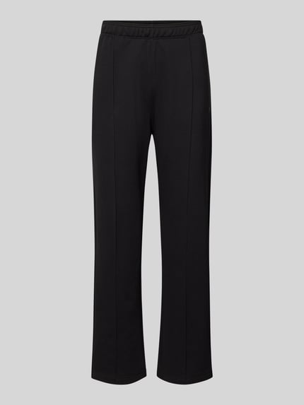 Produktfoto, Sweatpants mit Längsnähten und Label-Stitching von CHAMPION aus schwarzem Baumwoll-Mix, Relaxed-Fit, elastischer Bund, Innenbeinlänge bei Größe M 81 cm