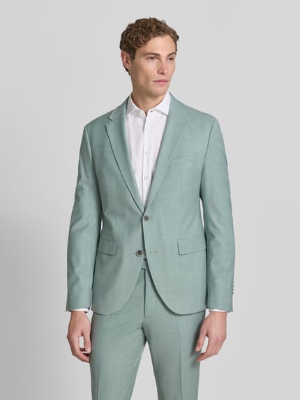 Männermodel trägt Slim Fit 2-Knopf-Sakko mit Pattentaschen Modell 'Monopoly' von CINQUE in Mint, Material-Mix mit Schafswoll-Anteil, Ganzkörperansicht von vorne. Rückenlänge bei Größe 50: 73 cm, Schulterbreite: 41 cm, Ärmellänge: 65 cm.