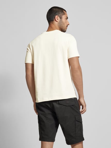 Champion T-shirt z nadrukiem z logo model 'Bookstore' Złamany biały 5