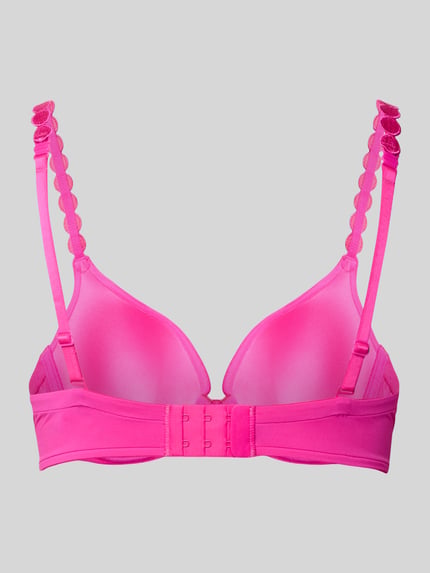 Frauenmodel trägt Beugelbeha mit hartvormige hals Modell 'Tom' van Marie Jo, materiaalmix met stretch, haakjessluiting, verstelbare spaghettibandjes, voorgevormde cups, geheel in felroze, glad oppervlak Ganzkörperansicht Rückansicht