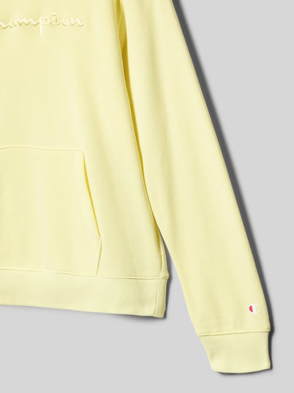 Productfoto, Hoodie aus Baumwoll-Mix mit Label-Stickerei van CHAMPION, katoenmengsel, rechte fit, capuchon, labelborduursel, kangoeroezak, zachte gele kleur, zichtbare textuur.