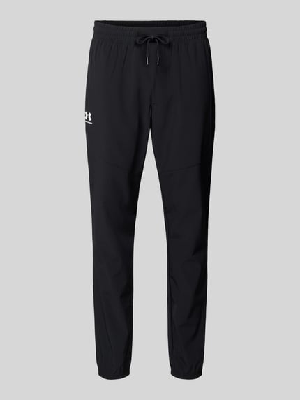 Produktfoto, schwarze Regular Fit Sweatpants mit Logo-Print Modell 'Vibe' von Under Armour, elastischer Bund, strukturierte Oberfläche.