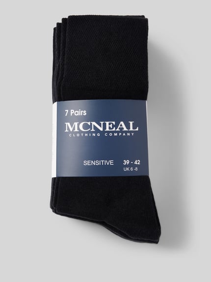 Produktfoto, Socken aus elastischem Baumwoll-Mix von MCNEAL im unifarbenen Design, 7er-Pack, elastisches Rippenbündchen, neutraler Hintergrund.