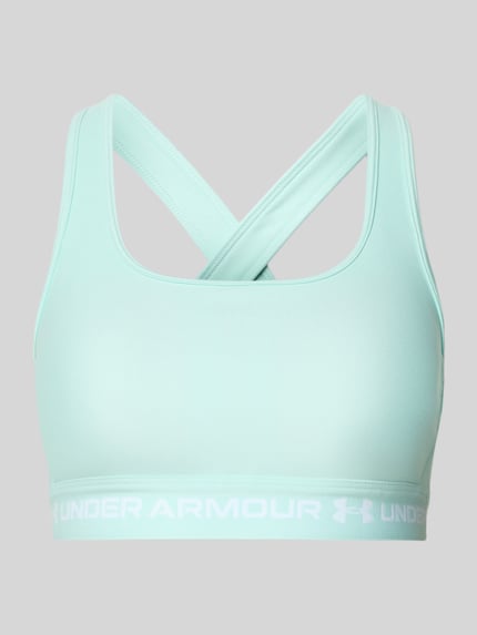 Produktfoto, lichtgroene Slim Fit SportBH met logoprint van Under Armour, elastische materiaalmix, cut-out op de rug