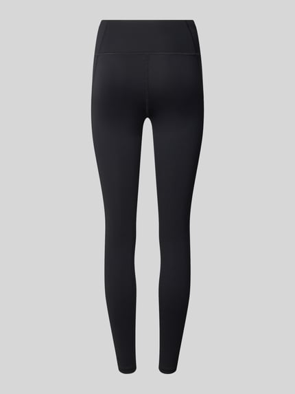Produktfoto, czarne legginsy z elastyczną mieszanką materiałów, krój skinny fit, elastyczny pas, nadruk z logo, Leggings mit Stretch-Anteil Modell 'CORE' od ASICS TIGER