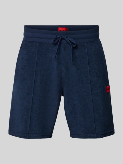 Produktfoto, Regular Fit Sweatshorts aus Baumwoll-Mix Modell 'TERRANCE' von HUGO in Dunkelblau, Optik: Unifarben, Label-Patch, elastischer Bundabschluss mit Tunnelzug, seitliche Eingrifftaschen, Materialverarbeitung: Sweat