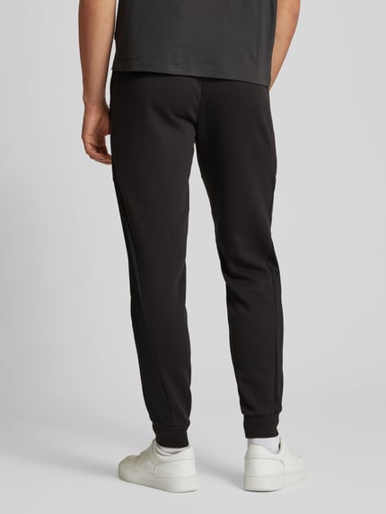 PUMA Performance Spodnie dresowe o kroju regular fit z detalem z logo Czarny 5