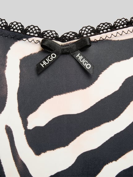 Produktfoto, String mit Spitzenbesatz von HUGO in Two-Tone-Optik mit Logo-Schleife Applikation, Stoff weich, Muster schwarz-weiß.