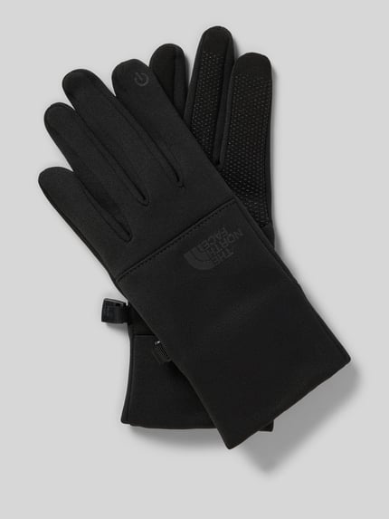 Produktfoto, schwarze Fingerhandschuhe mit Logo Modell 'ETIP' von The North Face, körpernahe Passform, glatte Textur, kontrastarme Optik