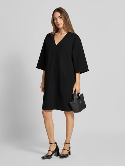 Christian Berg Woman Knielanges Kleid mit überschnittenen Schultern Black 1
