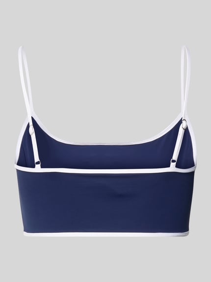 Vrouwenmodel draagt Bikini-Oberteil met Logo-Stitching van Polo Ralph Lauren in effen kleuren met verstelbare spaghettibandjes, stretch materiaal, rugdecolleté, vierkante hals, applicatie met gestikt logo, zonder beugel, unwattiert, ganzlichaamsaanzicht rugdecolleté.