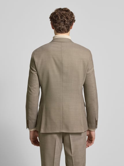 Männermodel trägt Slim Fit Anzug aus Schurwoll-Mix Modell 'H-HUGE-2Pcs-253' von BOSS, Unifarben, Zweiteiler, Ganzkörperansicht Rückansicht.