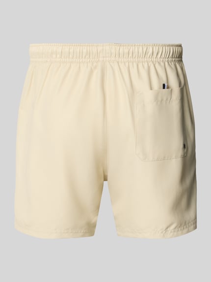 Produktfoto, Badeshorts mit Label-Applikation Modell 'DOGFISH' von BOSS in unifarbenem Beige, elastischer Bund, Gesäßtasche, leichte Textur