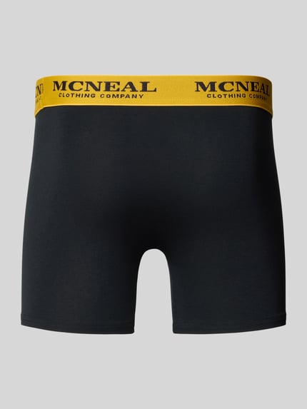 Produktfoto, Trunks mit elastischem Bund im 5er-Pack von MCNEAL aus Baumwoll-Elasthan-Mix in Schwarz mit gelbem Bund, körpernahe Passform