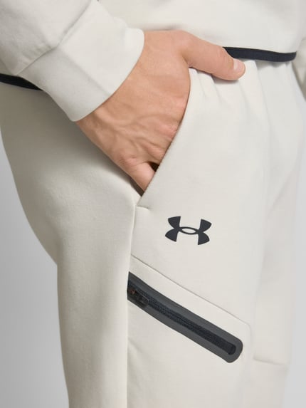 Under Armour Spodnie dresowe z elastycznym ściągaczem Złamany biały 3