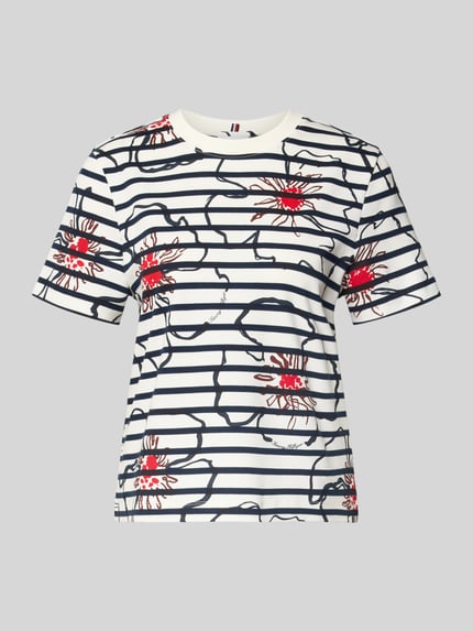 Productfoto, Regular Fit T-shirt model 'FLOWER GRAPHIC REG C-NK S' van Tommy Hilfiger voor dames met all-over motief, ronde hals, korte mouw, materiaal: puur katoen, kleuren wit, donkerblauw en rood, grafisch bloemenmotief.