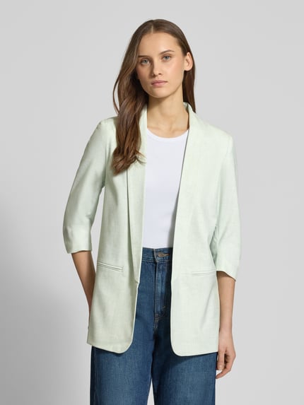 Kobiece modelka nosi Regular Fit Longblazer mit 3/4-Ärmeln Modell 'ELLY' od Only, melanż, krój regular fit, szalowy kołnierz, bez zapięcia, imitowane kieszenie z wypustką, jasny kolor, proste linie, delikatna tekstura materiału, widok całej sylwetki z przodu.