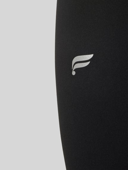 Produktfoto, schwarze Slim Fit Leggins mit Logo-Print Modell 'PURELUXE' von Fabletics, elastischer Bund, glatte Textur, Damen Leggins
