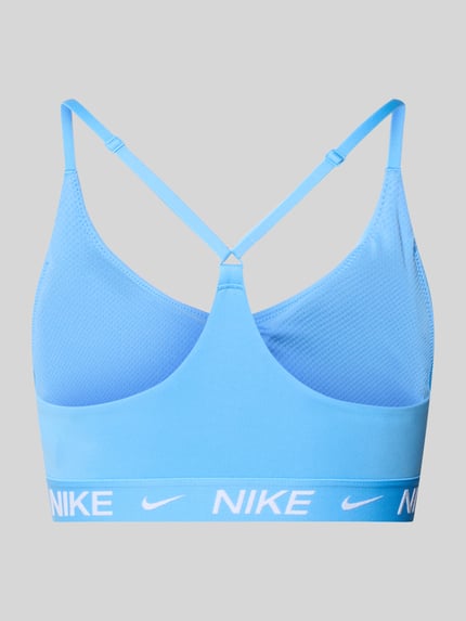 Produktfoto, blauer Slim Fit Sport-BH mit Logo-Detail Modell 'Indy' von NIKE TRAINING aus Elastischer-Material-Mix mit glatter Oberfläche.