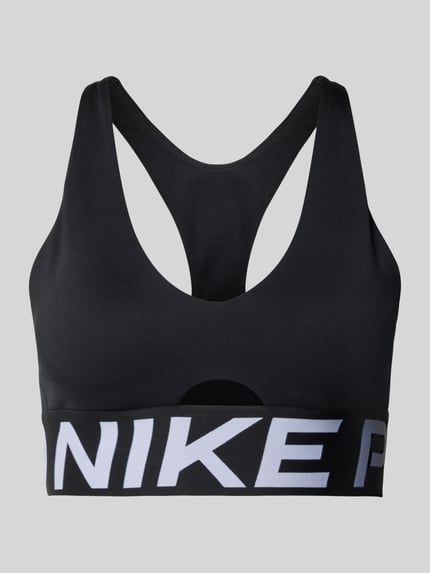 Produktfoto, Racerback-Bustier mit Cut Out und Label-Details von NIKE TRAINING in Schwarz, körpernahe Passform, Stretch-Material, großflächiger Logoprint.