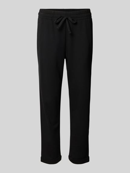 Produktfoto, Sweatpants in verkürzter Passform von Juvia aus mieszanka bawełny i modalu, krój straight fit, wpuszczane kieszenie, elastyczny pas, długość wewnętrzna nogawki w rozmiarze S: 66 cm, szerokość w rozmiarze S: 41 cm, kolor czarny, gładka tekstura
