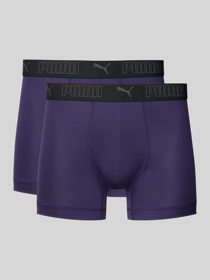 Produktfoto, Slim Fit Trunk mit Logo-Stitching von PUMA, fioletowy, elastyczny materiał, krój slim fit, logo i gumka z nadrukiem