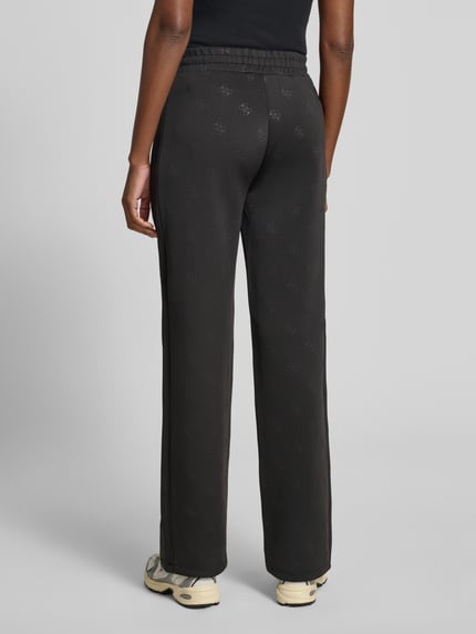 GUESS Activewear Spodnie dresowe o kroju wide fit z nadrukiem logo allover model 'Calista' Czarny 5