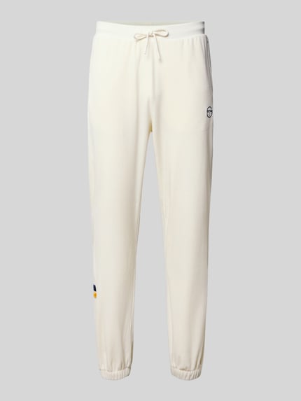 Produktfoto, Sweatpants mit elastischem Bund von SERGIO TACCHINI in Creme mit Label-Detail, lockerer Schnitt, Tunnelzug, Material-Mix mit Stretch-Anteil, 75 cm Innenbeinlänge bei Größe M