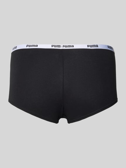 Frauenmodel trägt Pants mit elastischem Logo-Bund im 3er-Pack von PUMA, schwarzer Baumwoll-Elasthan-Mix, körpernaher Schnitt, Ganzkörperansicht Rückansicht.