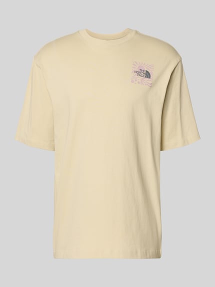 Produktfoto, Oversized T-Shirt mit Logo-Print von The North Face in Beige, reine Baumwolle, lockere Passform, Rundhalsausschnitt, glatte Struktur.