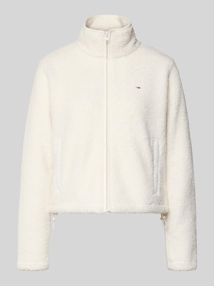 Produktfoto, Regular Fit Teddy-Jacke mit verdecktem Reißverschluss von Tommy Jeans, efekt: jednolity kolor, imitacja futerka, wyhaftowane logo, krój regular fit, stójka, zapięcie na zamek błyskawiczny, kieszenie zapinane na zamek błyskawiczny, wykończenie materiału: futerko