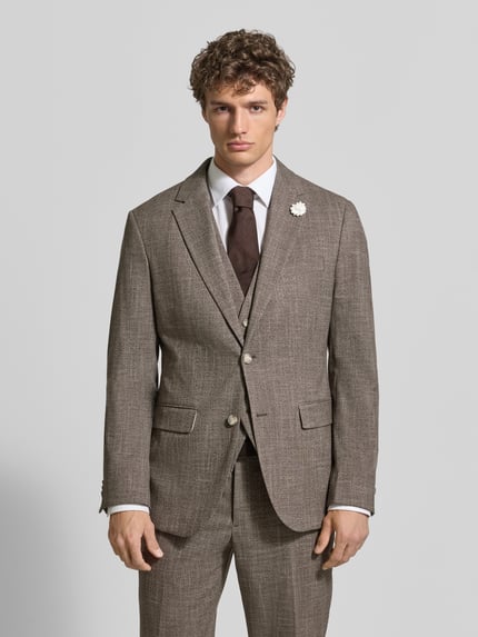 Männermodel trägt Slim Fit 2-Knopf-Sakko mit Reverskragen von MCNEAL, Material-Mix mit Viskose-Anteil, Blumen-Detail, Brustleistentasche und Pattentaschen, Ganzkörperansicht von vorne.