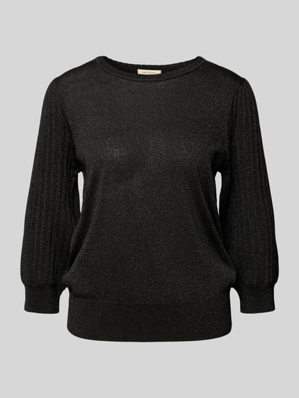 Produktfoto, schwarzer Strickpullover mit gerippten Abschlüssen und Glitter-Effekt, Modell 'GLITTA' von FREE/QUENT, lockerer Schnitt, Viskose-Mix mit Metall-Anteil, Rundhalsausschnitt, 3/4-Ärmel, feine Stricktextur vor grauem Hintergrund